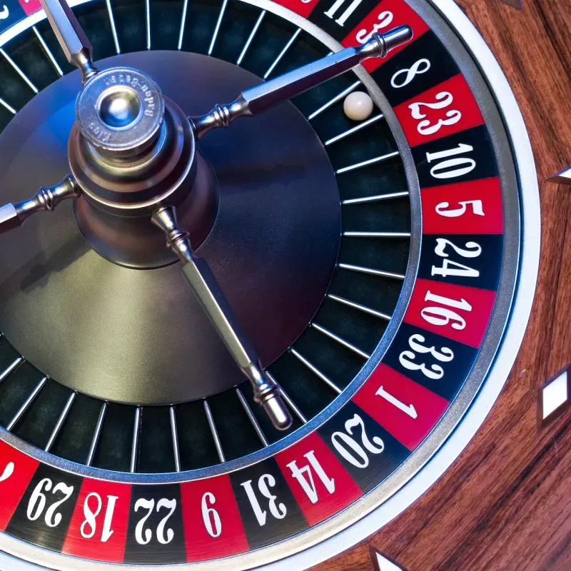 Top view of a roulette wheel with the ball in a numbered pocket